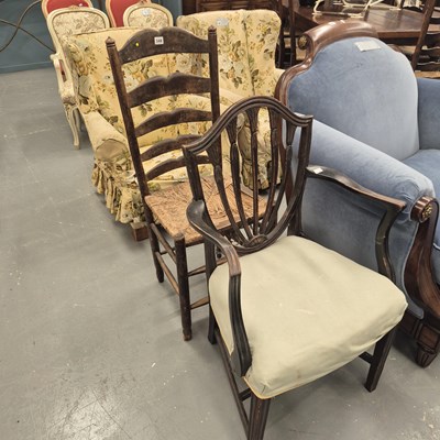 Lot 348 - An antique rush seat ladderback chair in the...