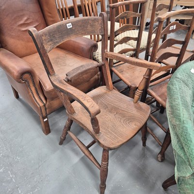 Lot 354 - A 19th century elm seat Oxford elbow chair