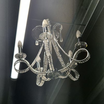 Lot 362 - A nickeled metal and glass five arm chandelier