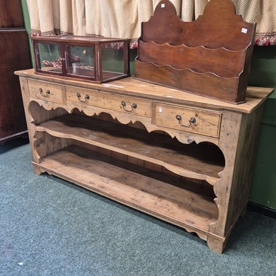 Lot 380 - A vintage pine sideboard, the three drawers...