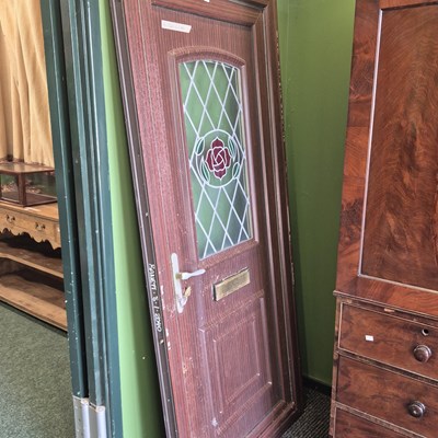 Lot 381 - A modern front door and frame with a leaded...