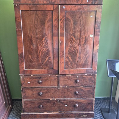 Lot 382 - A Victorian mahogany linen press, the twin...