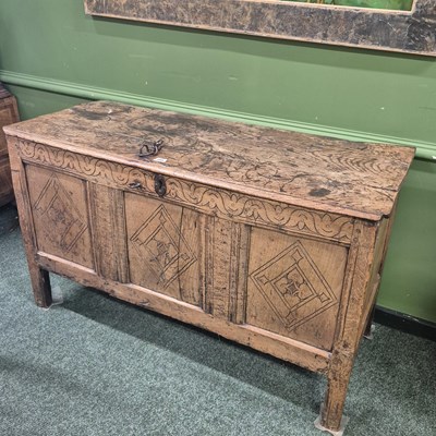 Lot 386 - An 18th century panel elm coffer, with incised...