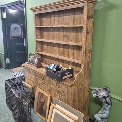 Lot 389 - A vintage pine dresser, the three shelf plate...