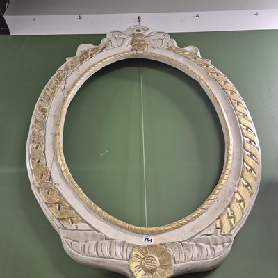 Lot 394 - A painted and gilt carved vacant mirror frame...