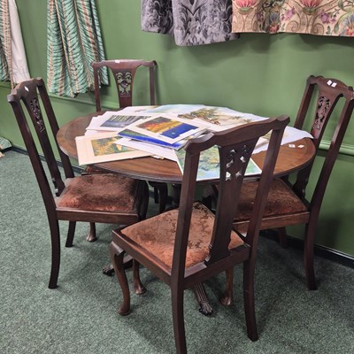 Lot 409 - A 20th century oval mahogany tilt top table on...