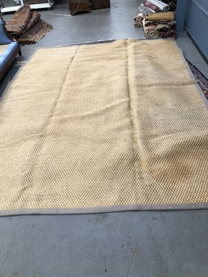 Lot 472 - A contemporary carpet of natural fibre 397 ×...