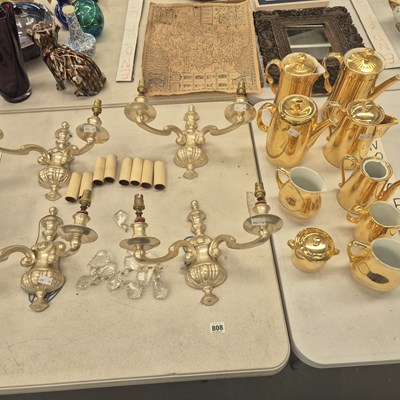 Lot 808 - A set of four classical-style wall lights and...
