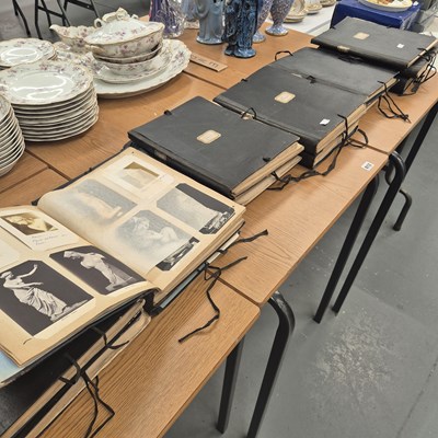 Lot 812 - Twelve large postcard and scrap albums with...
