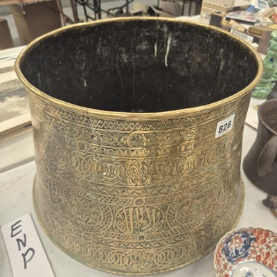 Lot 826 - A Middle Eastern brass vessel with engraved...