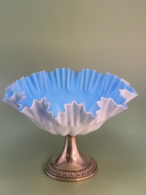 Lot 1824 - A WMF blue satin glass frilled bowl raised on...