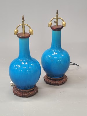 Lot 1832 - A pair of Chinese blue monochrome bottle vases...