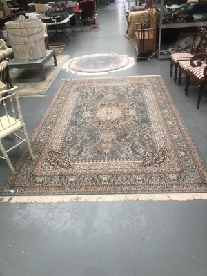 Lot 419 - A machine made carpet of Persian design 310 ×...