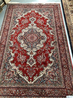 Lot 440 - A machine made rug of Persian design 234 × 130cm