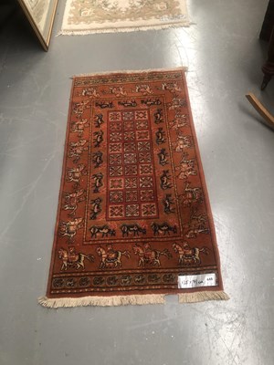 Lot 448 - A machine made rug of tribal design 135 × 71cm