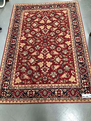 Lot 446 - A machine made rug of Persian design 198 × 137cm