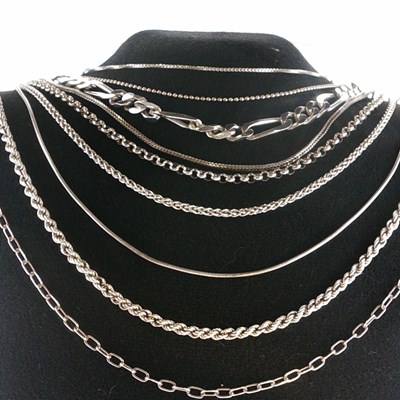 Lot 75 - Nine silver chains comprising figaro, rope,...