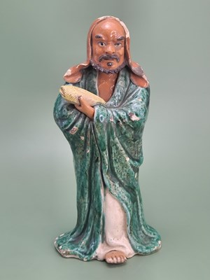 Lot 1856 - A Chinese pottery figure of the Immortal Lan...