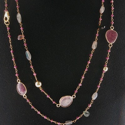 Lot 87 - A long silver gilt beaded chain interspersed...