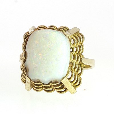 Lot 90 - A cushion shaped opal dressing claw set to an...