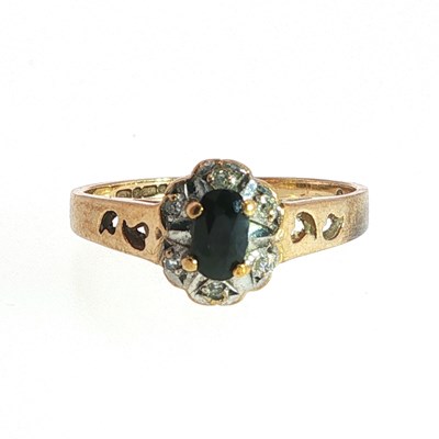 Lot 95 - A 9ct gold ring claw-set with an oval-cut...