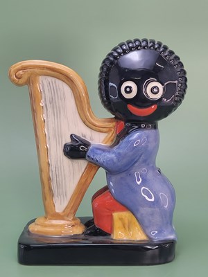 Lot 1865 - A Carlton Ware limited edition pottery harpist...