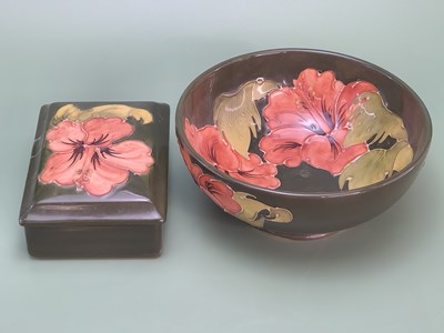 Lot 1867 - A Walter Moorcroft hibiscus pattern green...
