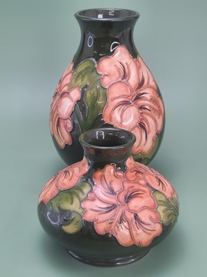 Lot 1868 - Two Walter Moorcroft vases slip trailed with...