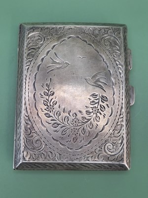 Lot 133 - A hallmarked silver cigarette case with...