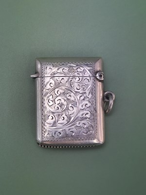 Lot 131 - A hallmarked silver vesta case with engraved...