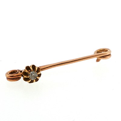 Lot 103 - An antique 9ct gold and diamond safety pin...