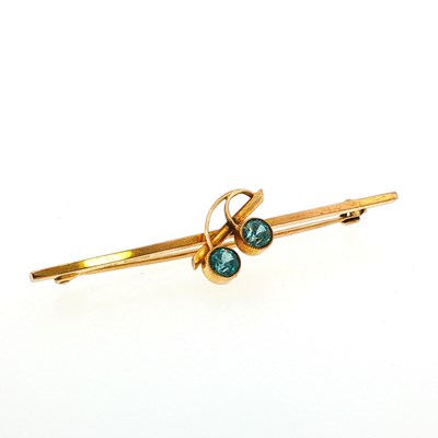 Lot 110 - A 9ct gold stone set bar brooch of stylised...