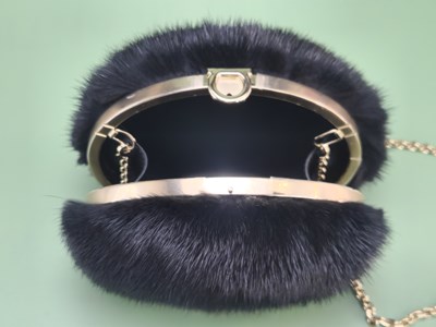 Lot 147 - A Salvatore Ferragamo black mink fur evening...