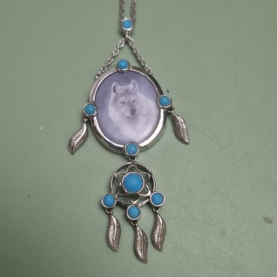Lot 157 - Sterling silver and turquoise set wolf pendant...