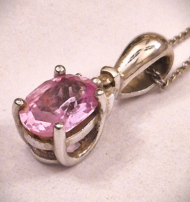 Lot 163 - A 9ct hallmarked white gold pink gemset and...