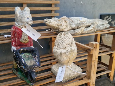 Lot 473 - Three garden ornaments, and a planter