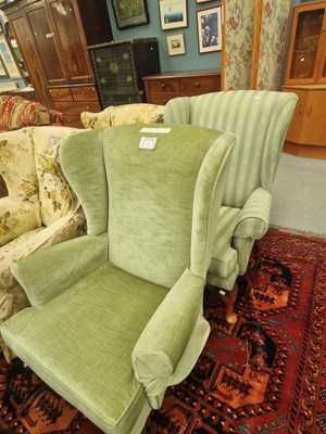 Lot 310 - Two Parker Knoll wing armchairs in...