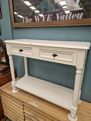 Lot 317 - A modern white console table, the twin drawers...