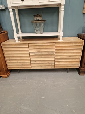 Lot 319 - A modern hardwood designer sideboard, the...