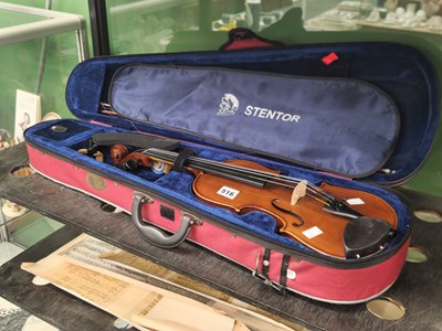 Lot 516 - A canvas cased Stentor violin and a bow