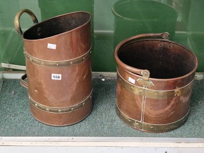 Lot 556 - Two brass coopered copper fire buckets