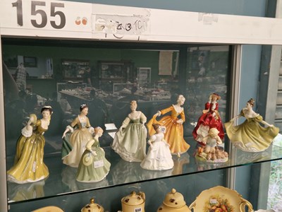Lot 557 - Eight Doulton figures of ladies, together with...