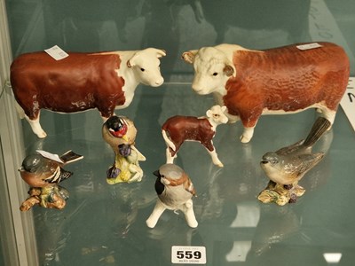 Lot 559 - Two Beswick bulls, a calf, three birds, and...