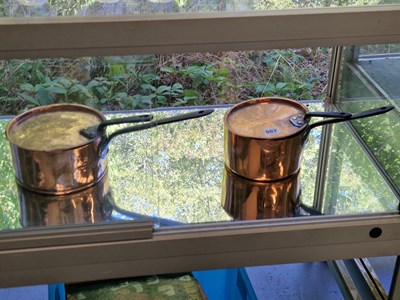 Lot 567 - Two Victorian copper saucepans and covers