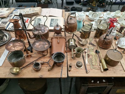 Lot 581 - Copper and brass wares: three kettles, two hot...