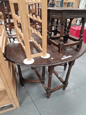 Lot 357 - A 19th century oak gateleg table on turned...