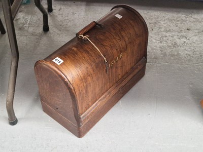 Lot 615 - A wooden cased Singer sewing machine