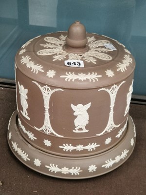 Lot 643 - A brown jasper ware cheese bell and stand
