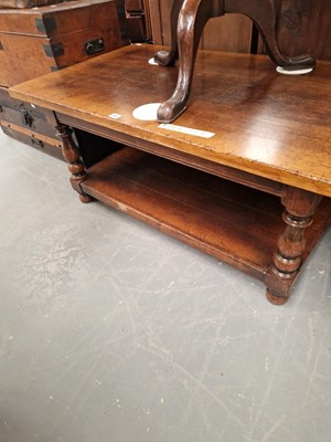 Lot 382 - An antique style oak coffee table with under...