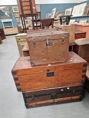 Lot 383 - A wood and metal bound travelling trunk, an...